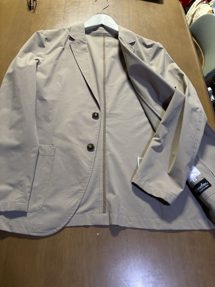 THE SHOP TK　㈱ワールド　ポリエステル100％Primeflex ストレッチ加工 ベージュアンコンジャケット
