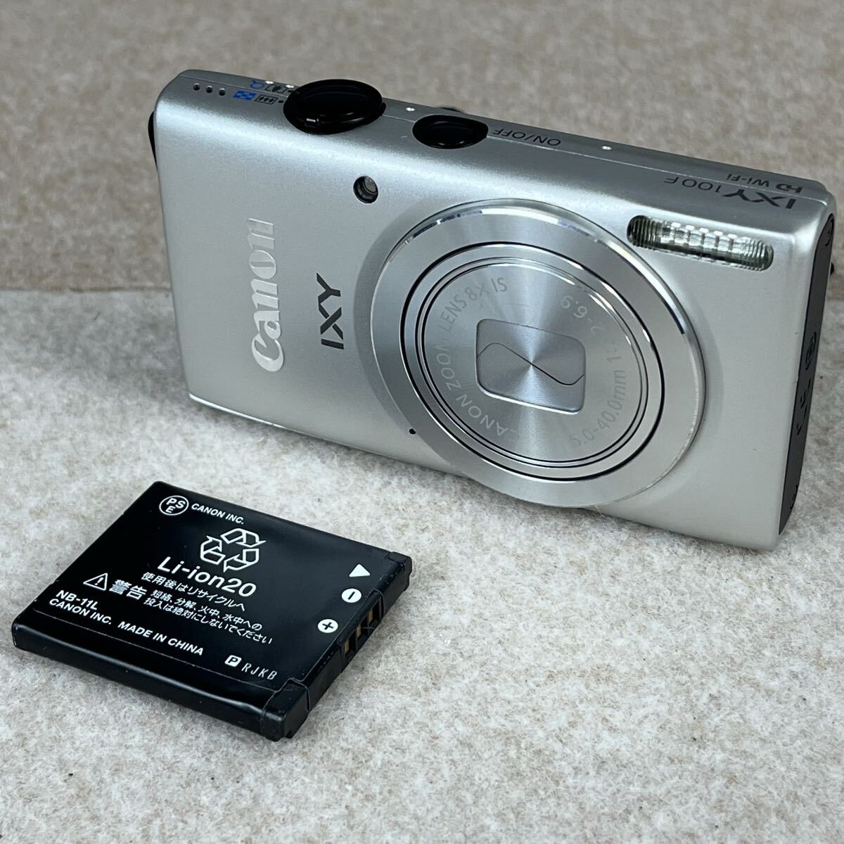 E Canon キヤノン IXY イクシー 100F PC1896 デジタルカメラ デジカメ シルバー Wi-Fi 8x ズーム かわせみ
