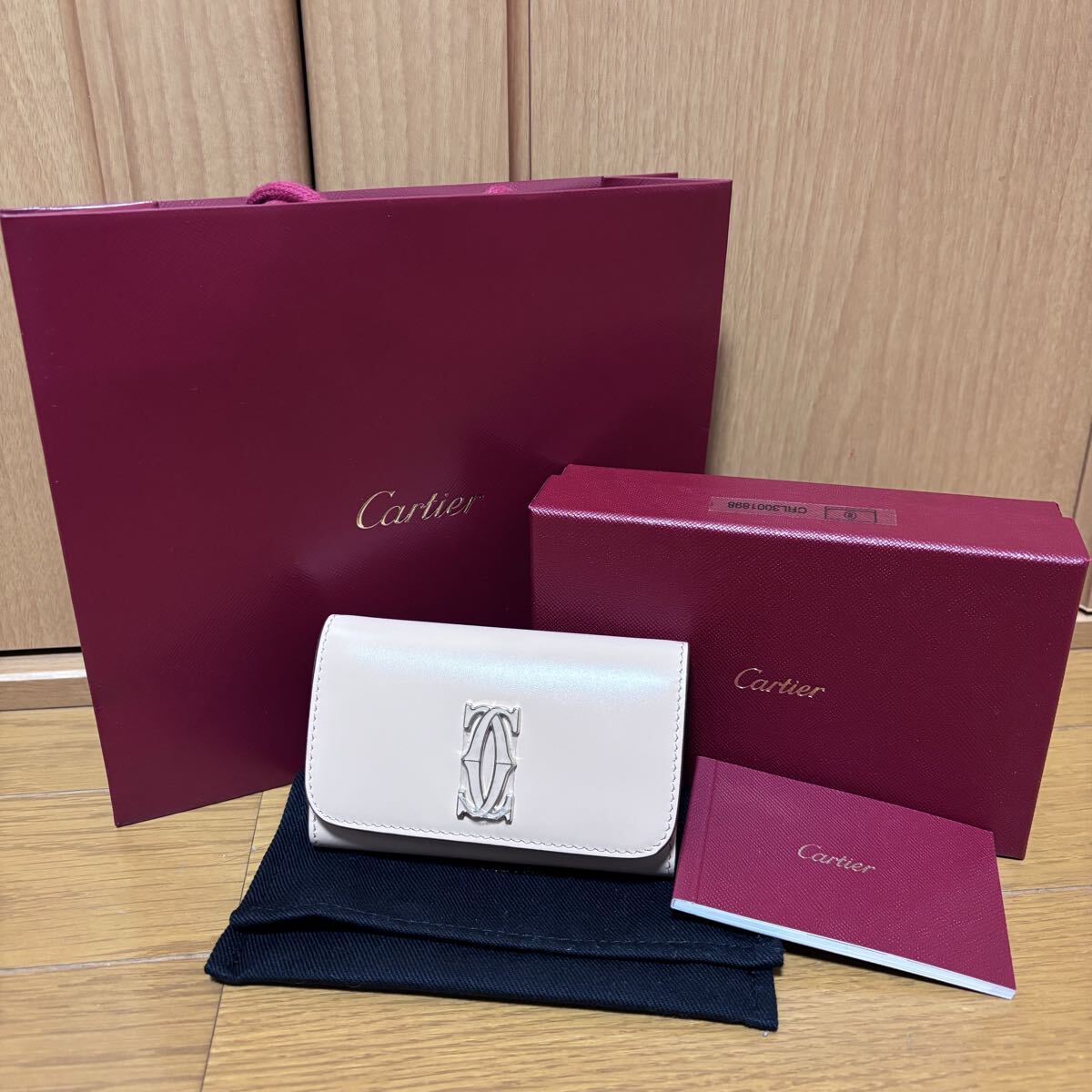 カルティエ キーケース 新品 未使用 6連キーケース ロゴ Cartier ピンク系 レザー 女性 レディース