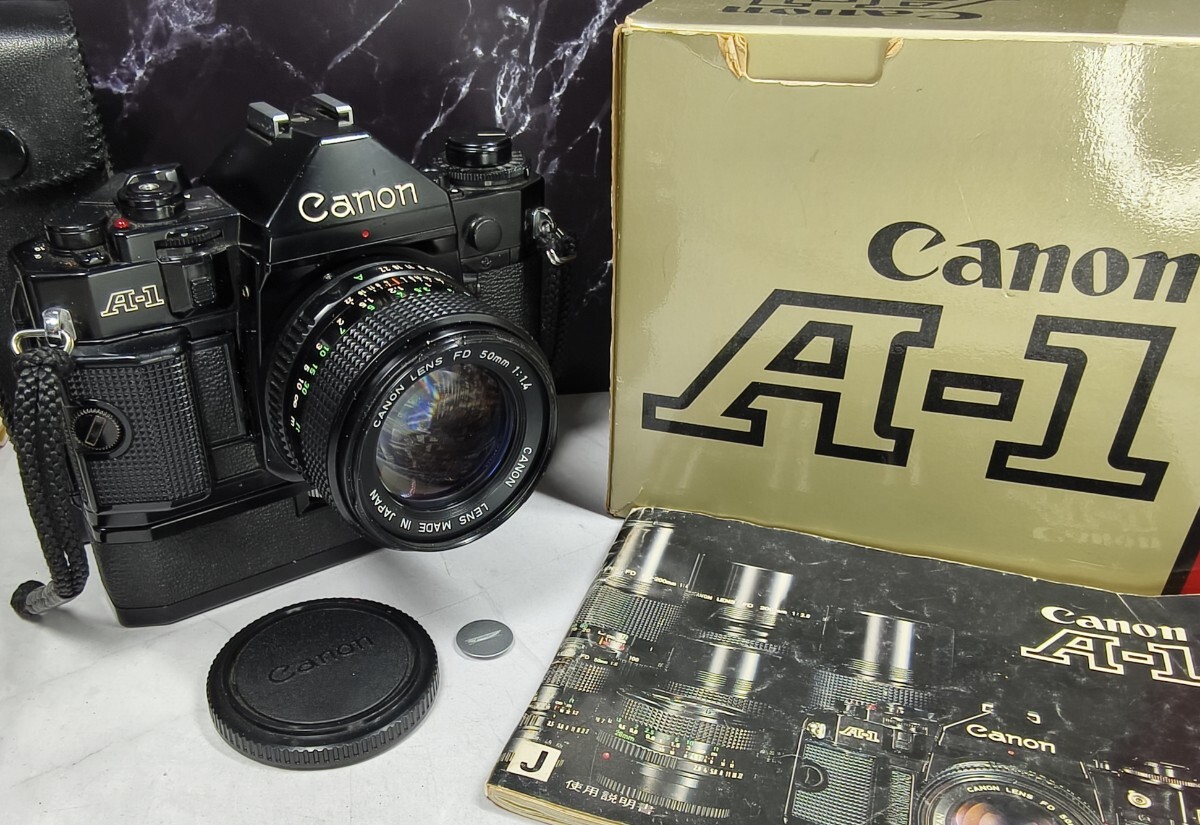【終活コレクション整理】Canon A-1 元箱付美品＋NEW FD 50mm f1.4 大口径単焦点＋純正ワインダーA 各動作良好 露出計OK 持病鳴き無し