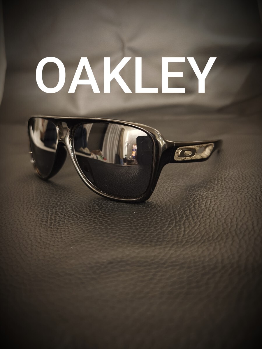 良品 オークリー OAKLEY サングラス トランジョンズグレイ ポリッシュブラック sunglasses archive 偏光レンズ プリズムブラック
