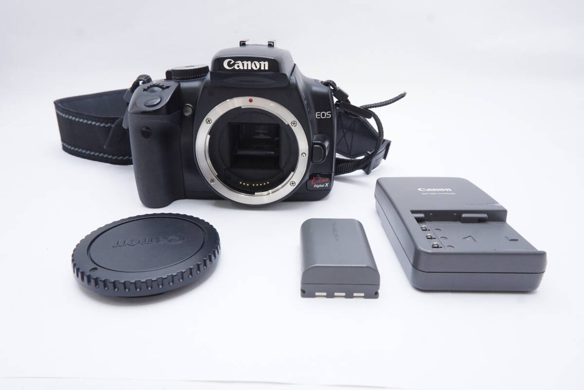 ○Canon キャノン EOS Kiss Digital X（ボディキャップ、充電器、バッテリー、ストラップ付）ジャンク品