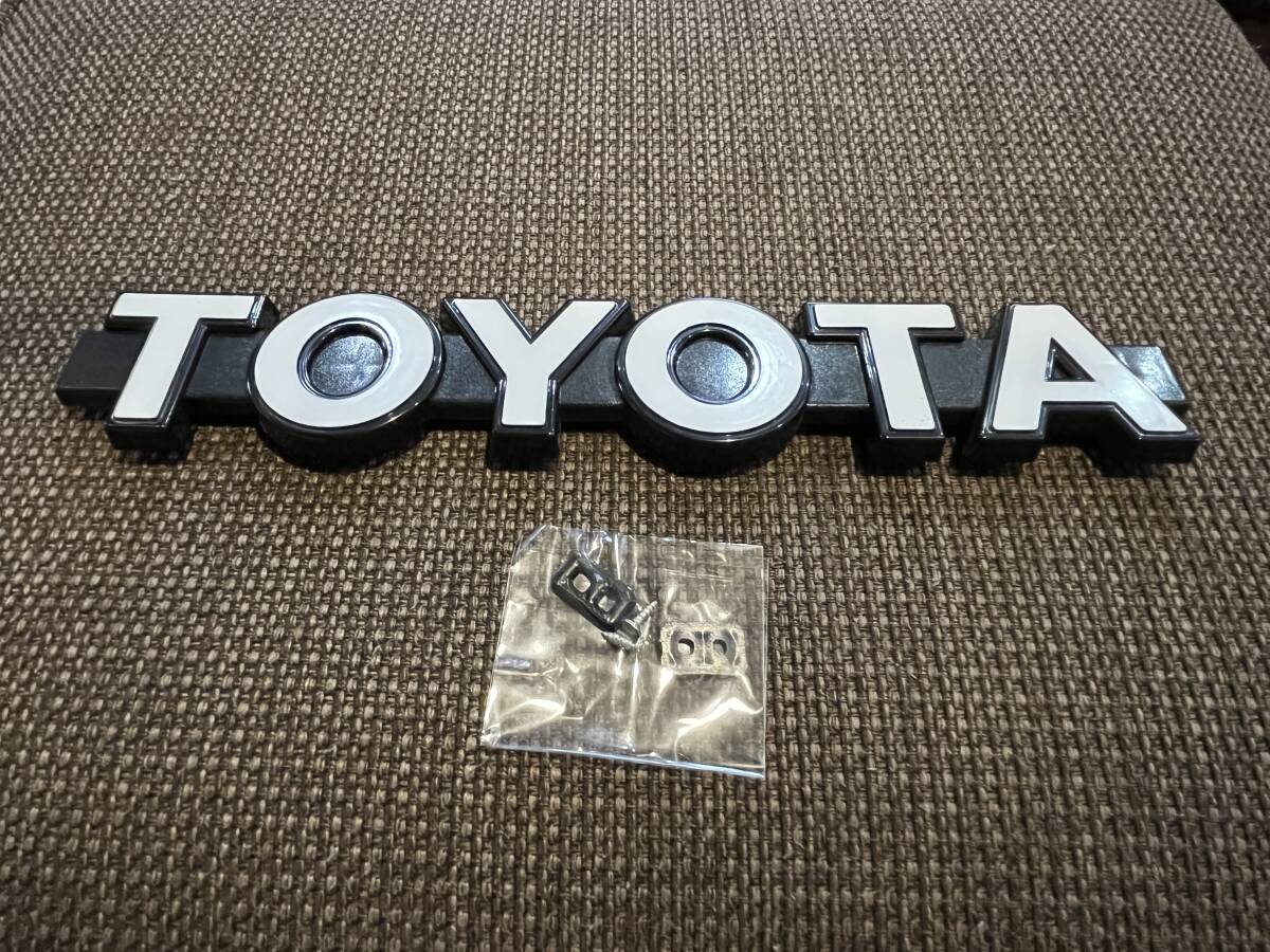 TOYOTA トヨタ フロント グリル エンブレム 白 検索用→ランクル プラド 40 60 70 80 100 78 サクシード プロボックス ハイラックス