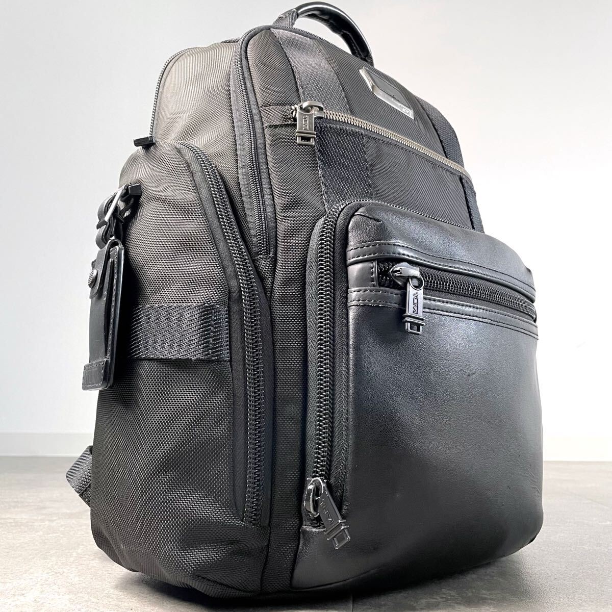 入手困難/定価12万◎ トゥミ TUMI ブラボ　キャンバス　リュック バックパック メンズ　ビジネス レザー 本革 A4 PC収納 ブラック 大容量