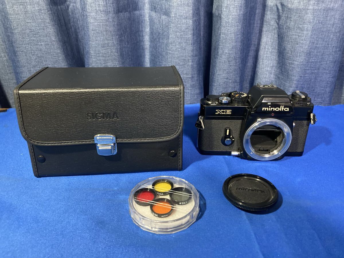 ミノルタ　XE ジャンク　SIGMAのケースとフィルター付き　（ フィルムカメラ　MINOLTA）