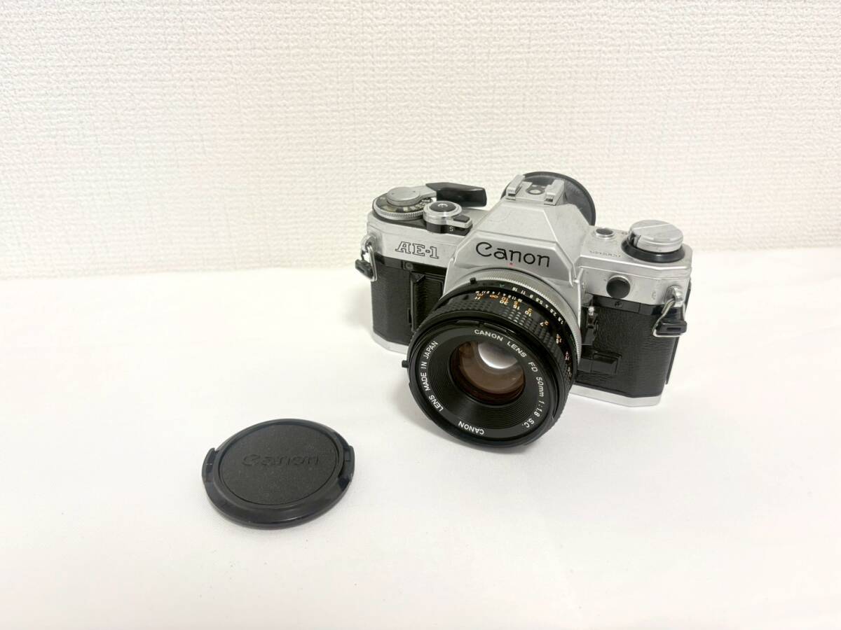 D8254*4　Canon　キャノン　AE-1　一眼レフフィルムカメラ　CANON LENS FD 50㎜ 1:1.8 S.C.　レンズキャップ付き