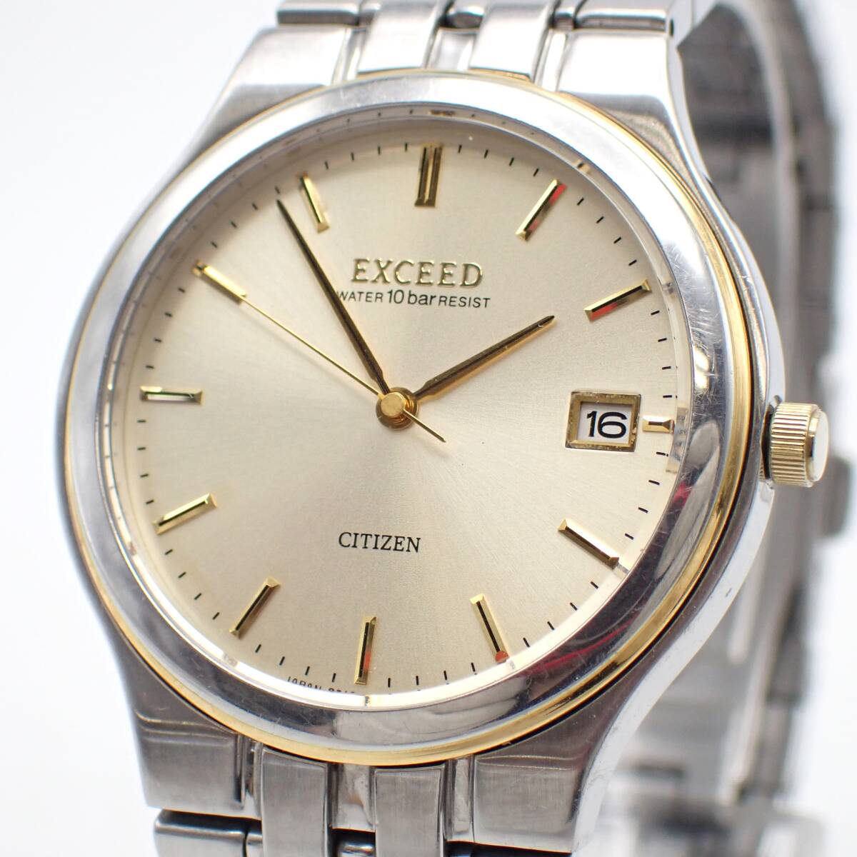 稼働品 1円～☆CITIZEN シチズン QZ メンズ腕時計 EXCEED エクシード 0310-H04244 ゴールド文字盤 デイト ラウンド アナログ/金0603-200