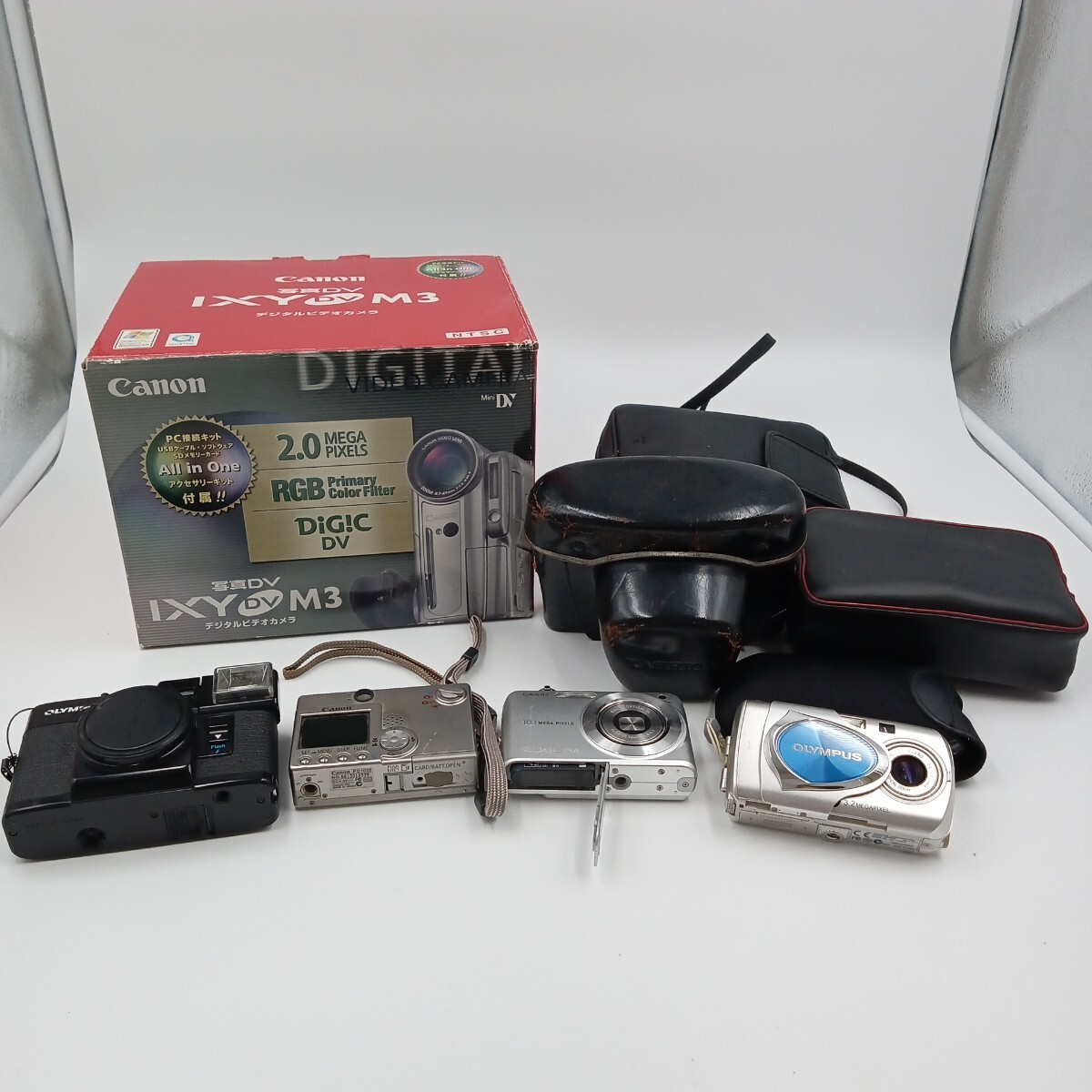F カメラ 8点まとめ コンパクトデジタルカメラ ビデオカメラ フィルムカメラ Canon CASIO OLYMPUS など ジャンク含む 動作未確認