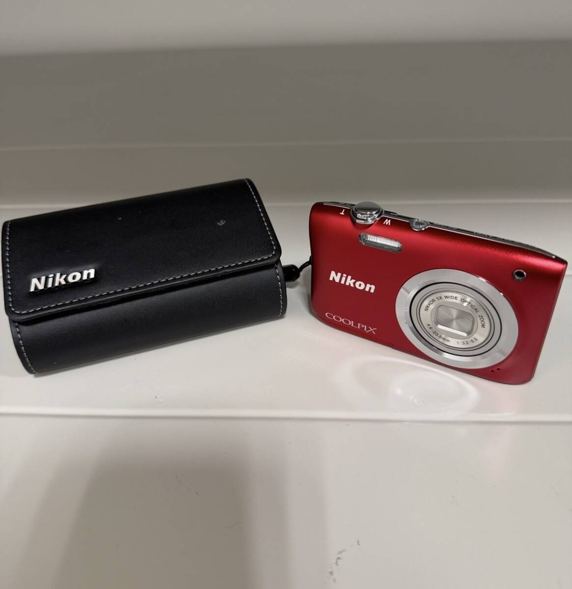 1487★ニコン Nikon COOLPIX A100 レッド バッテリー付き 通電未確認 中古品 ケース付