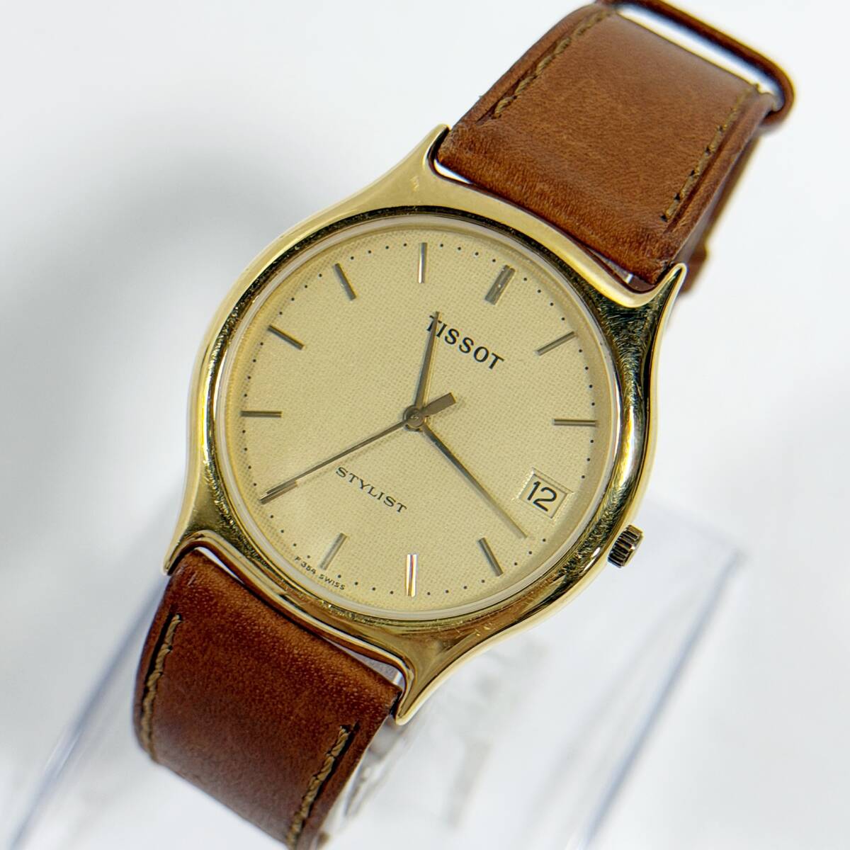 【54427V】稼働品 TISSOT STYLIST 腕時計 クォーツ式 電池交換済 ゴールド文字盤 ブラウン 経年保管品