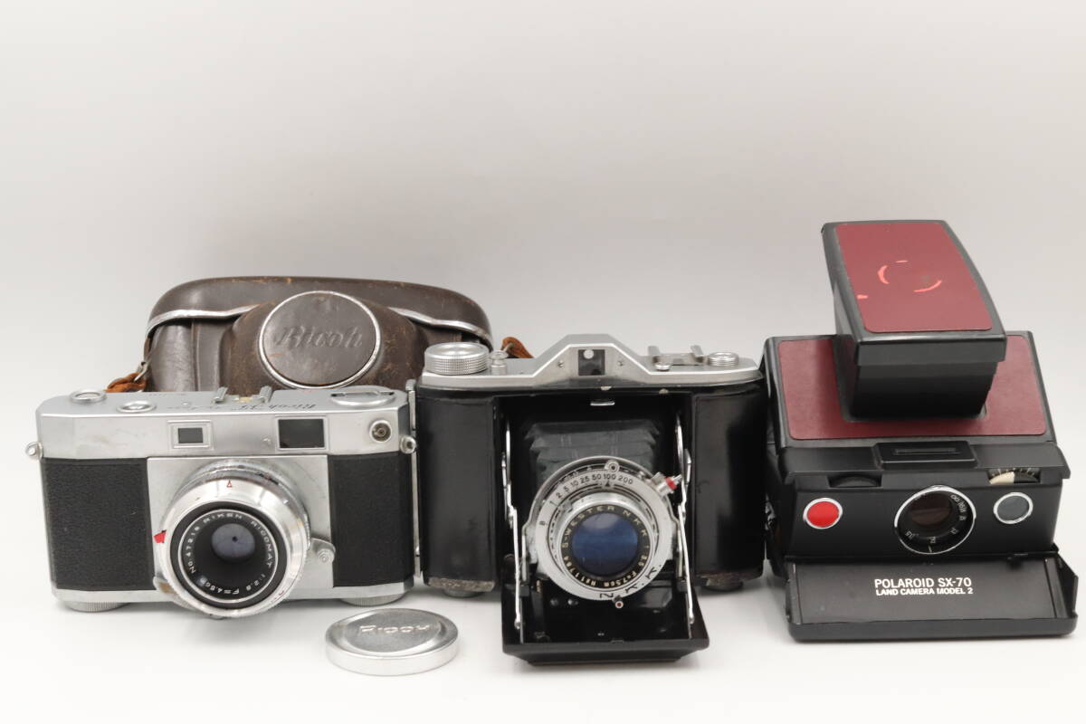 ◆299 POLAROID SX-70 LAND CAMERA MODEL2 / RICOH 35 De luxe / N,K,K S-WESTER f=7.5cm 1:3.5