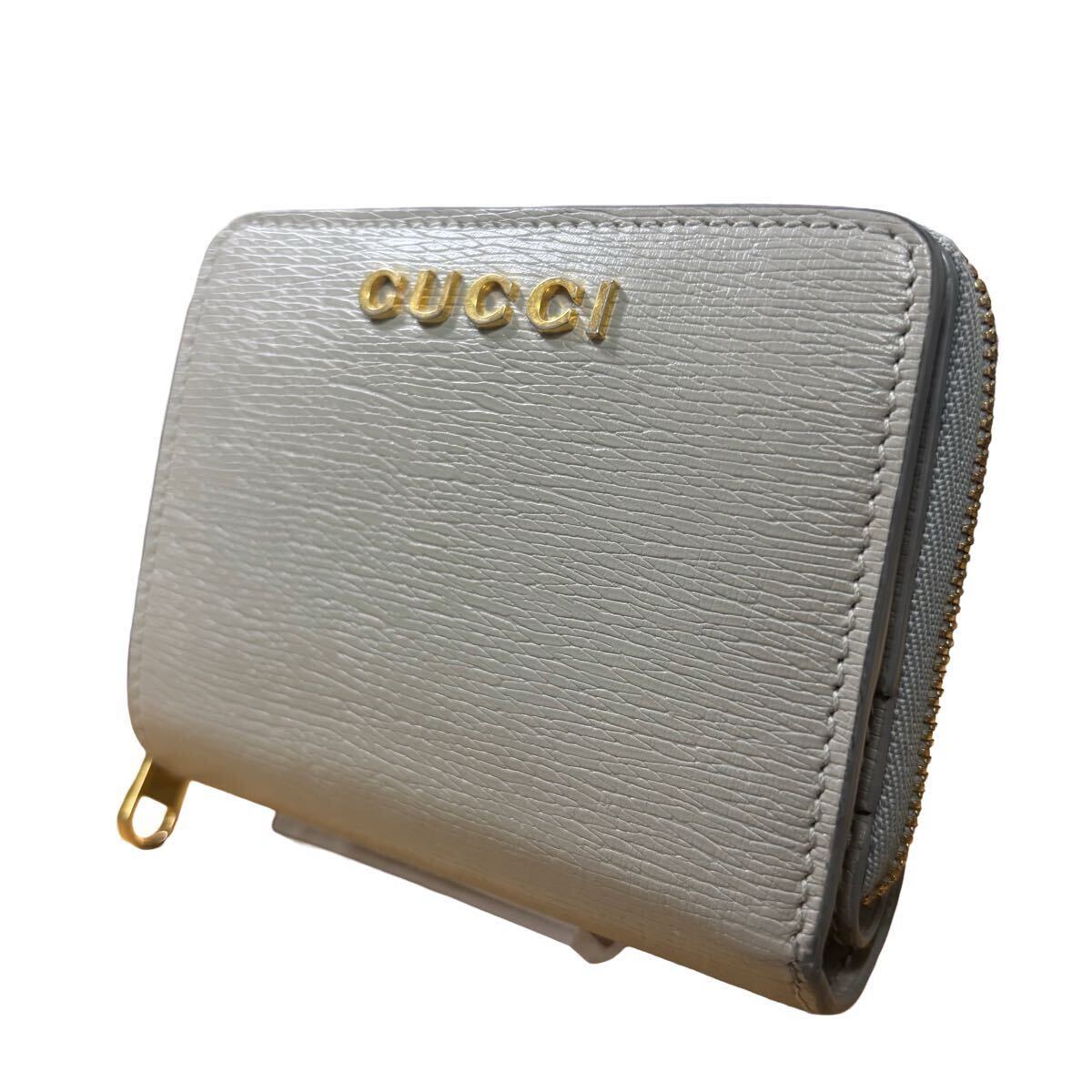 現行 近年 GUCCI 二つ折り スクリプト ラウンドジップ ロゴ レザー グレー レザー ロゴ