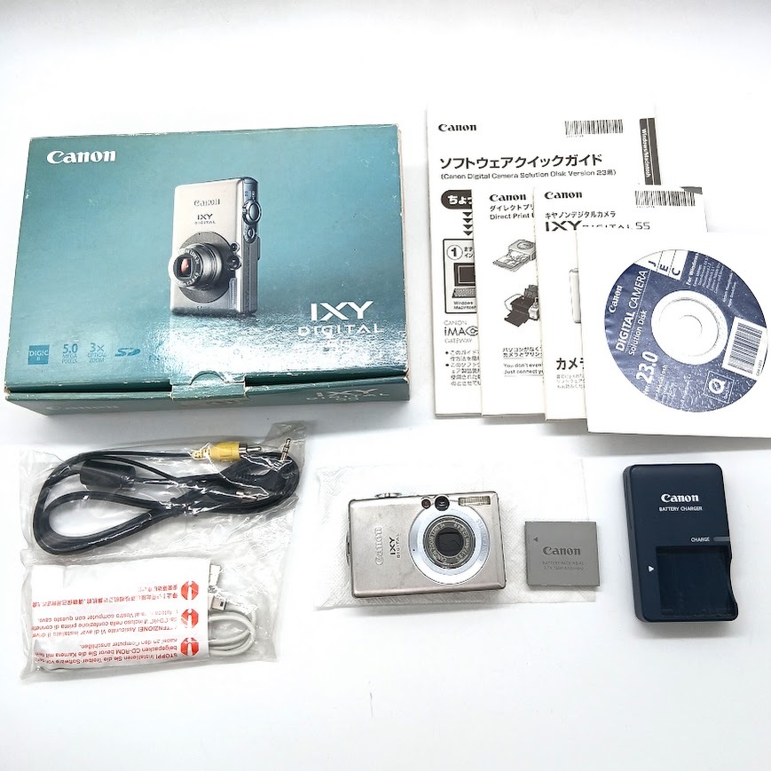 【AU-9】通電確認済　Canon　IXYDIGITAL70　PC1193　キャノン　イクシーデジタル　シルバーカラー　デジカメ　バッテリー/充電器/箱/冊子付