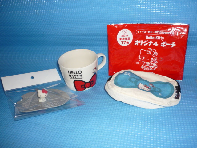 bレア品★未使用★2010年ハローキティ　リボン柄Three applesマグカップとシリコン蓋とポーチの3点