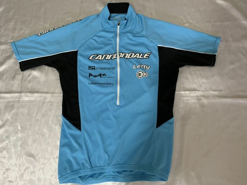 キャノンデール Cannondale 半袖サイクルジャージ 水色 古着 青 ブルー 黒 ウェア ロードバイク Tシャツ ビッグロゴ 自転車競技 グラベル