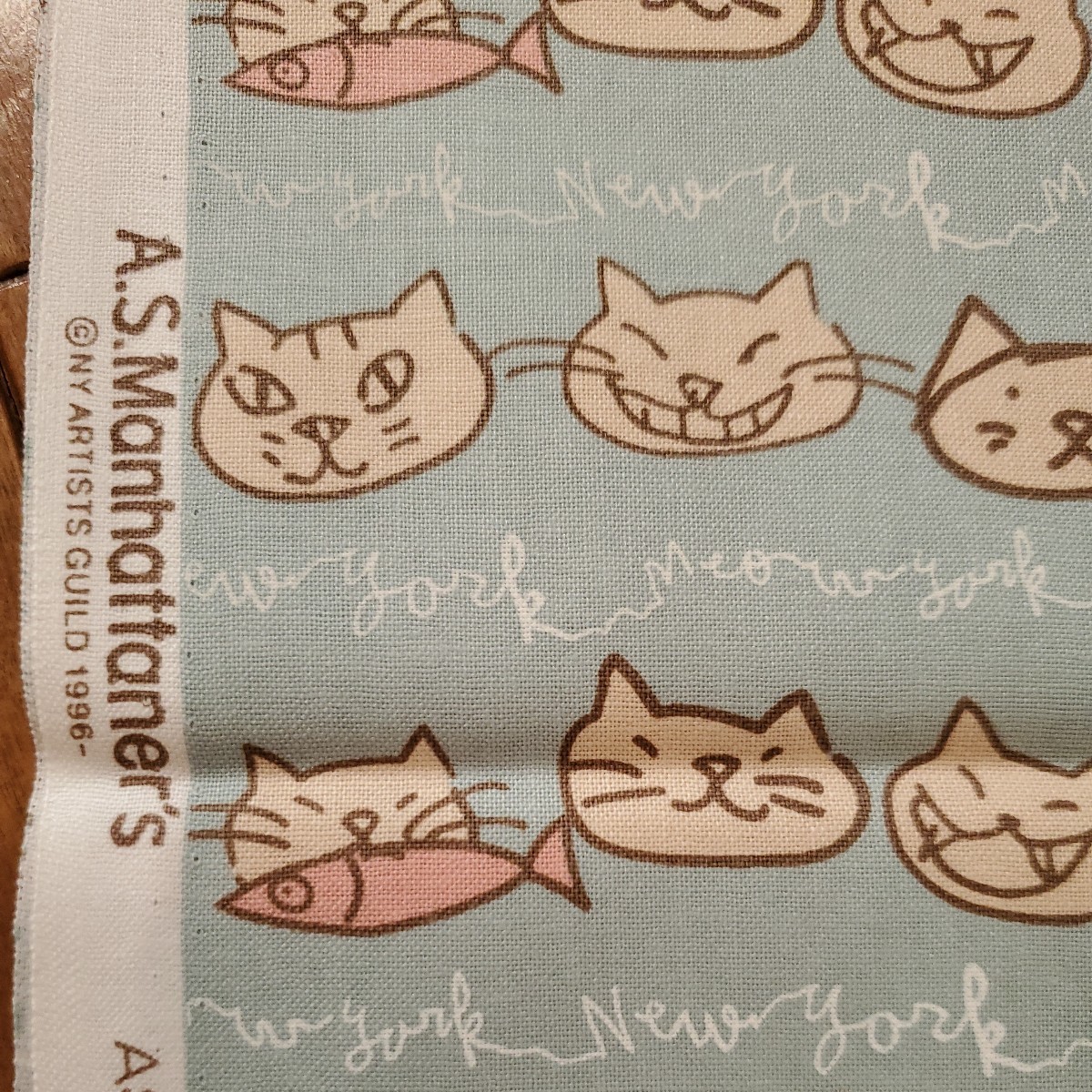 グリーン 生地巾×1m A.S.Manhattaner's エー・エス・マンハッタナーズ 【顔並び】シーチング生地 ねこ 猫 ネコ　　ニューヨーク　緑　