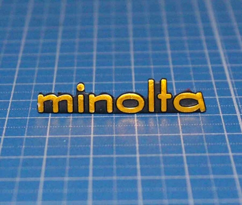 [eiA181]Minolta ロゴ　プレート　金色　ミノルタ 　カメラ　ケース　パーツ　