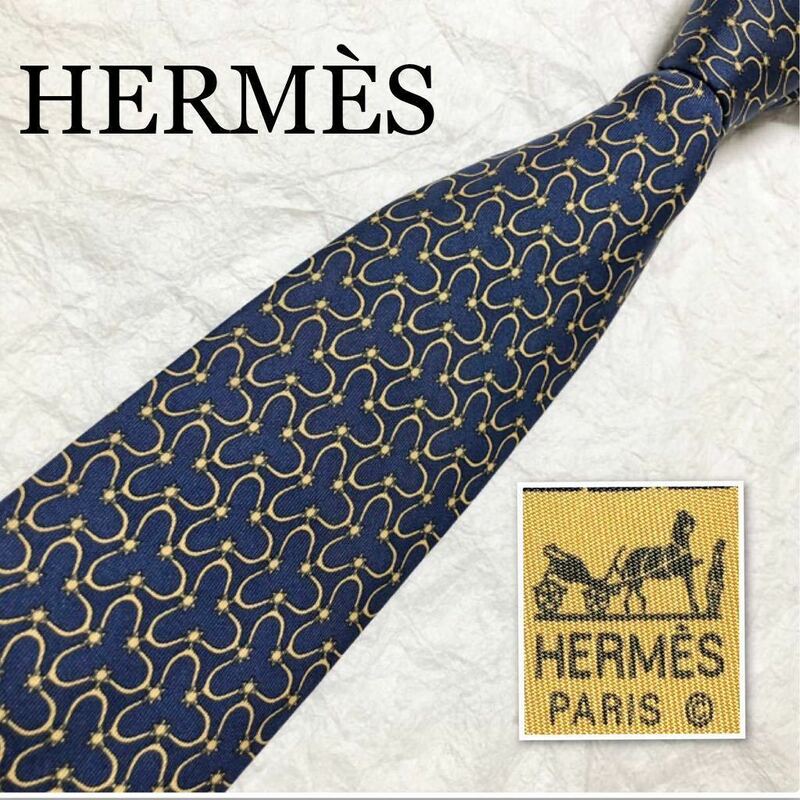 HERMES エルメス　ネクタイ　金具　太陽　総柄　シルク100% フランス製　ネイビー×イエロー