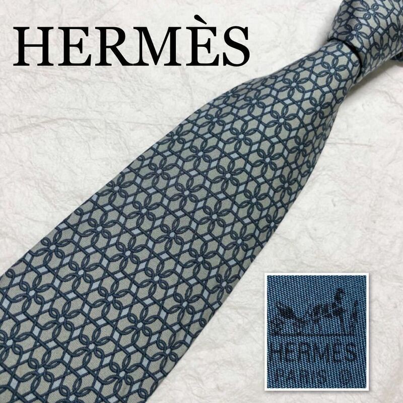 HERMES エルメス　ネクタイ　金具　花柄　総柄　シルク100% フランス製　グレー　ブルー