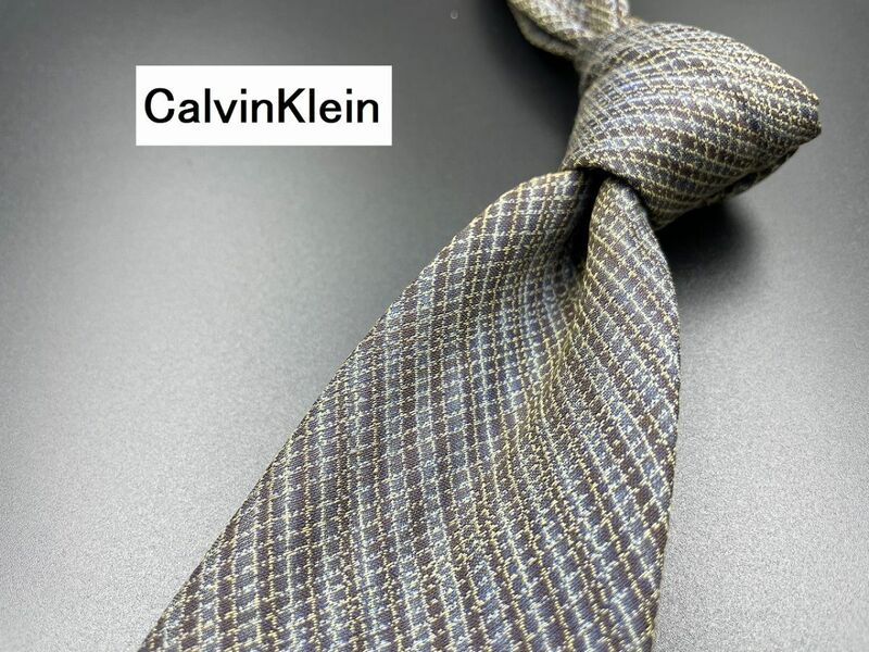 【美品】CalvinKlein　カルバンクライン　レジメンタル柄　ネクタイ　3本以上送料無料　グレイ系　0303028