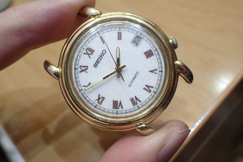 セイコー/SEIKO ◆7002-8010 ステップベゼル/ゴールド 梨地文字盤 自動巻きメンズ腕時計