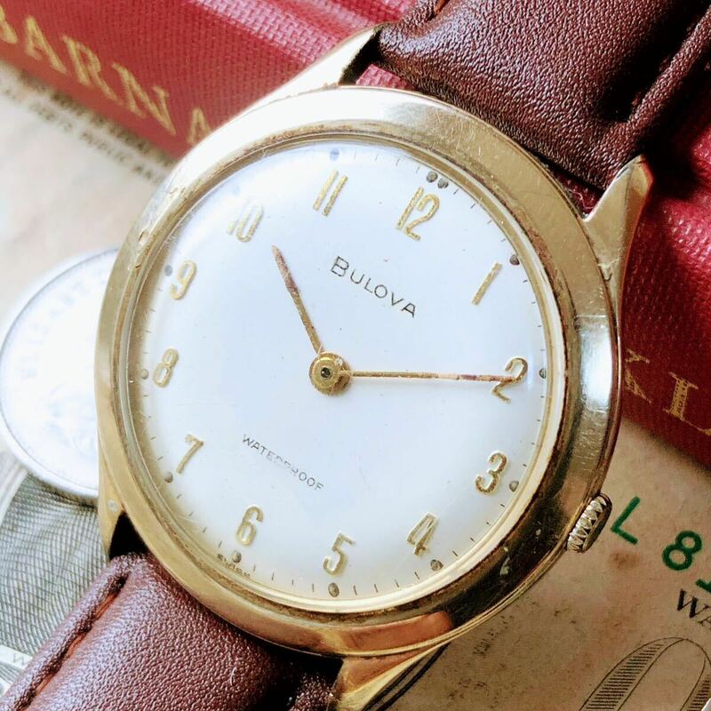 #3100【シックでお洒落】メンズ 腕時計 ブローバ BULOVA 手巻き 動作品 アンティーク ヴィンテージ 機械式 新品ベルト 金メッキ 1959年 2針