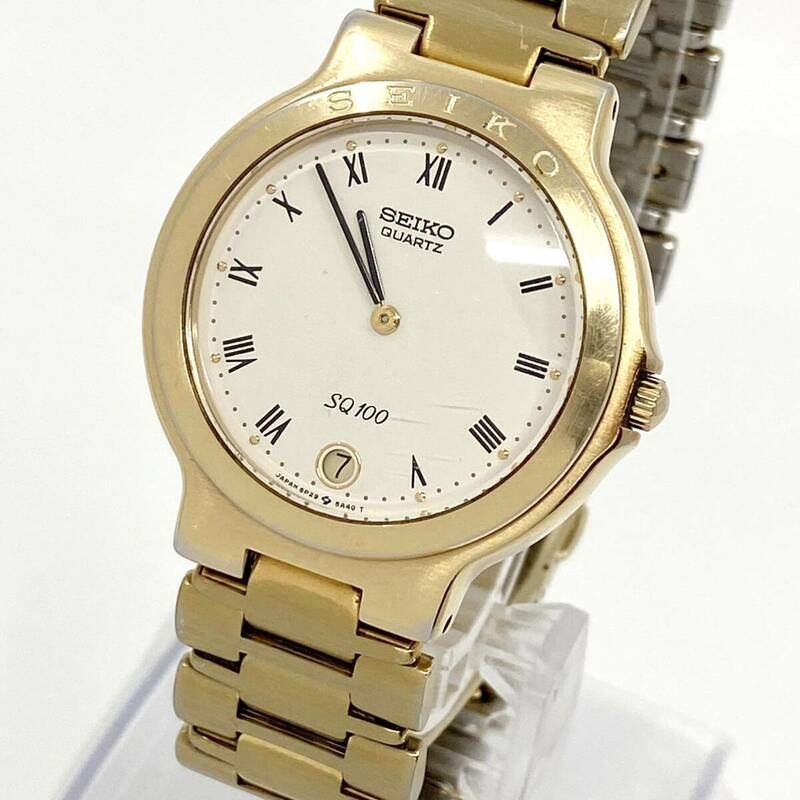 SEIKO SQ100 腕時計 デイト クッション ローマン 2針 クォーツ quartz ゴールド 金 5P29-6A50 セイコー Y869