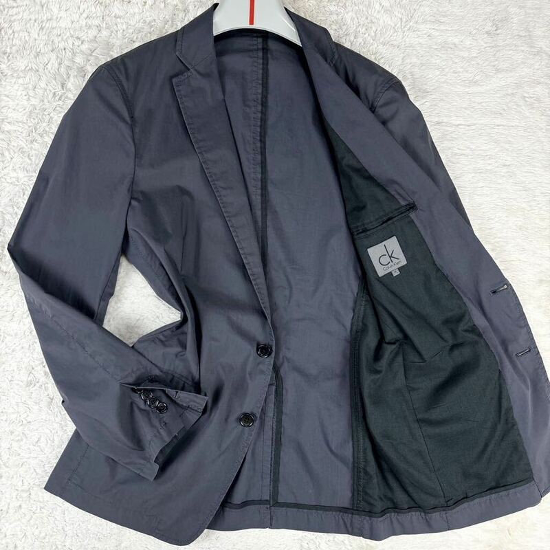 1円 美品 M~L カルバンクラインCalvin Klein テーラードジャケットトラベルアンコンストレッチ伸縮性洗えるロゴボタンメンズグレー